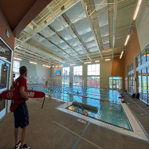 lifeguard watching lap lanes at pool