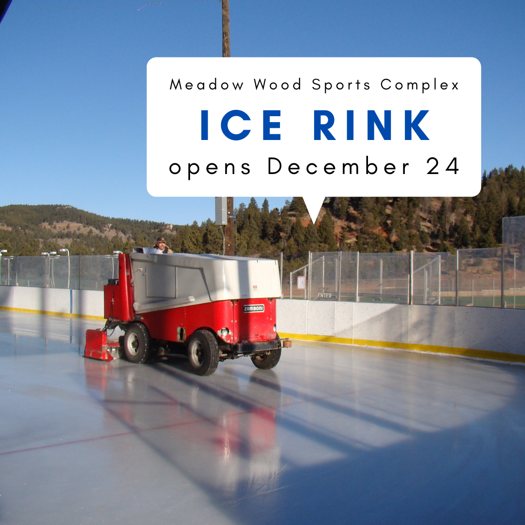 man driving a zamboni on ice rink