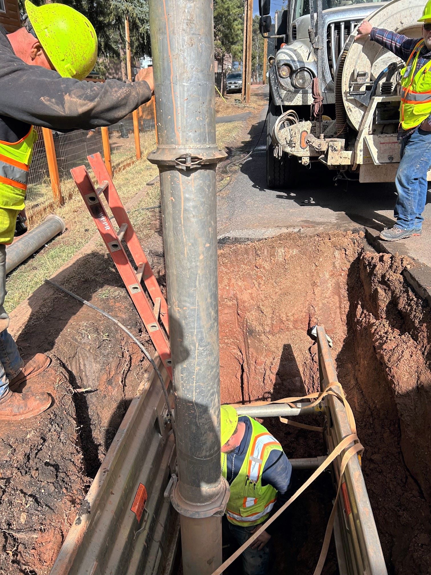 public works crews fixing pipes
