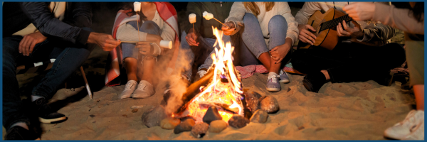 people sitting by campfire