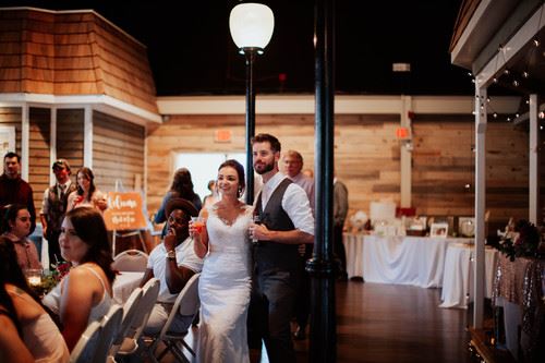 Bride and Groom standing with drinks